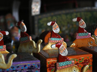 In Srinagar, Kashmir, India, on December 14, 2024, Christmas ornaments of Santa Claus are ready at the workshop before being sent to the mar...