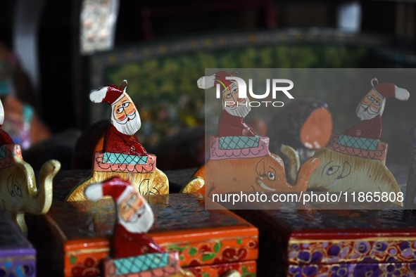 In Srinagar, Kashmir, India, on December 14, 2024, Christmas ornaments of Santa Claus are ready at the workshop before being sent to the mar...