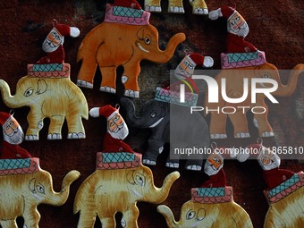 In Srinagar, Kashmir, India, on December 14, 2024, Christmas ornaments of Santa Claus are ready at the workshop before being sent to the mar...