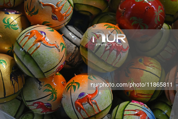 In Srinagar, Kashmir, India, on December 14, 2024, Christmas baubles are ready at the workshop before being sent to the market ahead of Chri...