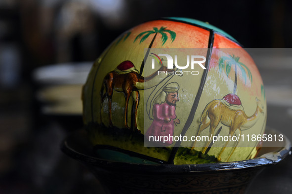 A Christmas bauble is seen at the workshop before being sent to the market ahead of Christmas celebrations in Srinagar, Kashmir, on December...