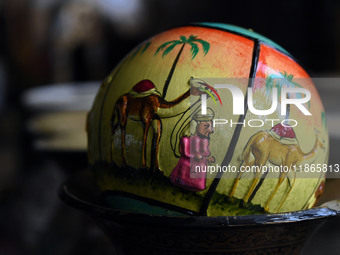 A Christmas bauble is seen at the workshop before being sent to the market ahead of Christmas celebrations in Srinagar, Kashmir, on December...