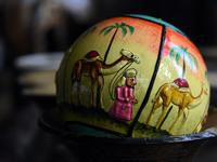 A Christmas bauble is seen at the workshop before being sent to the market ahead of Christmas celebrations in Srinagar, Kashmir, on December...