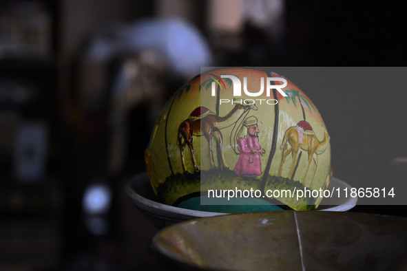 A Christmas bauble is seen at the workshop before being sent to the market ahead of Christmas celebrations in Srinagar, Kashmir, on December...