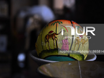 A Christmas bauble is seen at the workshop before being sent to the market ahead of Christmas celebrations in Srinagar, Kashmir, on December...