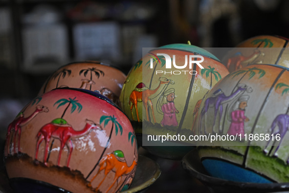 In Srinagar, Kashmir, India, on December 14, 2024, Christmas baubles are ready at the workshop before being sent to the market ahead of Chri...