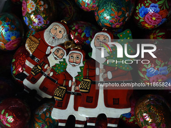 In Srinagar, Kashmir, India, on December 14, 2024, Christmas ornaments of Santa Claus are ready at the workshop before being sent to the mar...