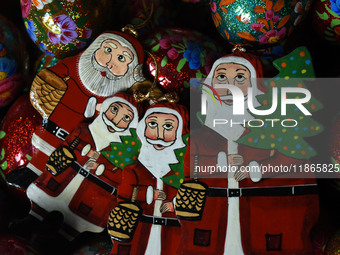 In Srinagar, Kashmir, India, on December 14, 2024, Christmas ornaments of Santa Claus are ready at the workshop before being sent to the mar...