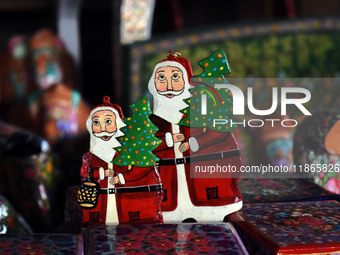 In Srinagar, Kashmir, India, on December 14, 2024, Christmas ornaments of Santa Claus are ready at the workshop before being sent to the mar...