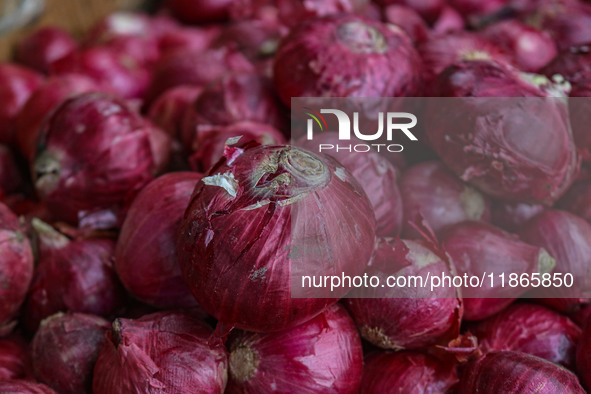 Onions are kept for sale at a market in Srinagar, Jammu and Kashmir, on December 14, 2024. 