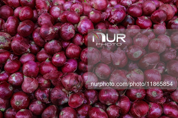 Onions are kept for sale at a market in Srinagar, Jammu and Kashmir, on December 14, 2024. 