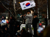 Citizens cheer after the impeachment of President Yoon Suk-yeol is passed in Seoul, South Korea, on December 14, 2024. Approximately 2 milli...