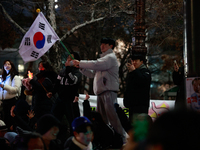 Citizens cheer after the impeachment of President Yoon Suk-yeol is passed in Seoul, South Korea, on December 14, 2024. Approximately 2 milli...