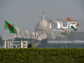 Indian and Bangladesh flags are seen in Kolkata, India, on December 14, 2024, ahead of practice for the Vijay Diwas celebration by the armed...