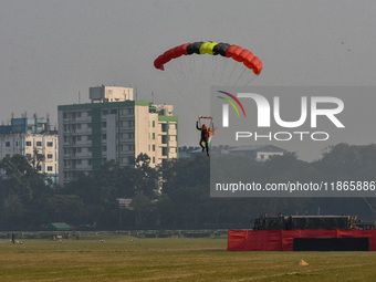 Paratroopers of the Indian Army perform a drop to showcase to the public during the Vijay Diwas celebration, as seen in Kolkata, India, on D...