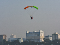 Paratroopers of the Indian Army perform a drop to showcase to the public during the Vijay Diwas celebration, as seen in Kolkata, India, on D...