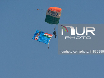 Paratroopers of the Indian Army perform a drop to showcase to the public during the Vijay Diwas celebration, as seen in Kolkata, India, on D...