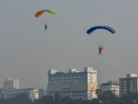 Paratroopers of the Indian Army perform a drop to showcase to the public during the Vijay Diwas celebration, as seen in Kolkata, India, on D...