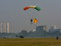 Paratroopers of the Indian Army perform a drop to showcase to the public during the Vijay Diwas celebration, as seen in Kolkata, India, on D...