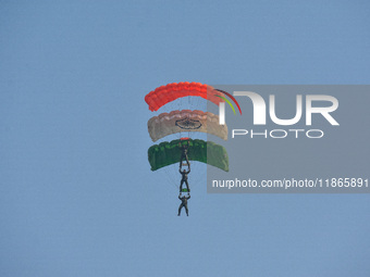 Paratroopers of the Indian Army perform a drop to showcase to the public during the Vijay Diwas celebration, as seen in Kolkata, India, on D...