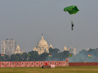 Paratroopers of the Indian Army perform a drop to showcase to the public during the Vijay Diwas celebration, as seen in Kolkata, India, on D...