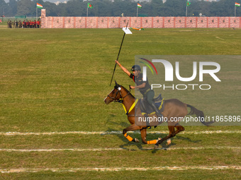 Soldiers of the armed forces perform acrobatic stunts on horses during practice for the Vijay Diwas celebration, as seen in Kolkata, India,...