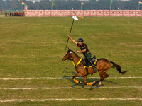 Soldiers of the armed forces perform acrobatic stunts on horses during practice for the Vijay Diwas celebration, as seen in Kolkata, India,...