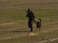 An officer and his army dog display to the public during practice ahead of the Vijay Diwas celebration, as seen in Kolkata, India, on Decemb...