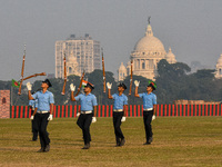 Officers of the Indian Air Force perform stunts with rifles during a practice ahead of the Vijay Diwas celebration in Kolkata, India, on Dec...