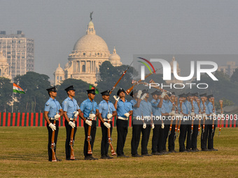 Officers of the Indian Air Force perform stunts with rifles during a practice ahead of the Vijay Diwas celebration in Kolkata, India, on Dec...