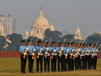 Officers of the Indian Air Force perform stunts with rifles during a practice ahead of the Vijay Diwas celebration in Kolkata, India, on Dec...