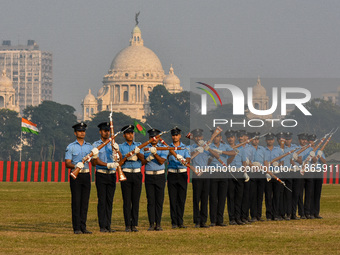 Officers of the Indian Air Force perform stunts with rifles during a practice ahead of the Vijay Diwas celebration in Kolkata, India, on Dec...