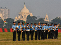 Officers of the Indian Air Force perform stunts with rifles during a practice ahead of the Vijay Diwas celebration in Kolkata, India, on Dec...