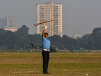 Officers of the Indian Air Force perform stunts with rifles during a practice ahead of the Vijay Diwas celebration in Kolkata, India, on Dec...