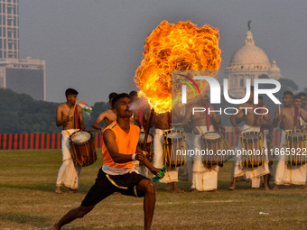 Soldiers perform stunts with fire during a practice display ahead of the Vijay Diwas celebration in Kolkata, India, on December 14, 2024. 'V...