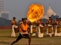 Soldiers perform stunts with fire during a practice display ahead of the Vijay Diwas celebration in Kolkata, India, on December 14, 2024. 'V...