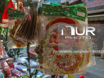 Santa Claus items are seen in a shop at a market ahead of the Christmas celebrations in Srinagar, Jammu and Kashmir, on December 14, 2024. (