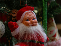 A Santa Claus decorative article is displayed at a market ahead of the Christmas celebrations in Srinagar, Jammu and Kashmir, on December 14...