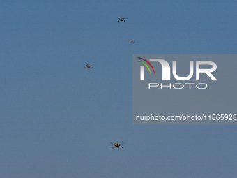 Military drones are seen during practice ahead of the Vijay Diwas celebration in Kolkata, India, on December 14, 2024. (