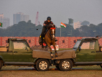 Soldiers of the armed forces perform acrobatic stunts on horses during practice for the Vijay Diwas celebration, as seen in Kolkata, India,...