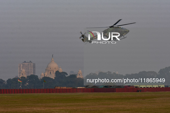 Indian army helicopters display maneuvers during a practice ahead of the Vijay Diwas celebration in Kolkata, India, on December 14, 2024. 