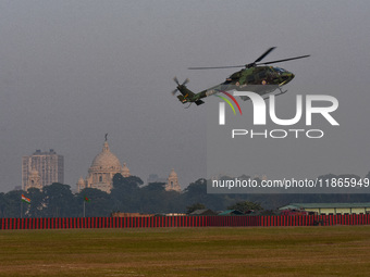 Indian army helicopters display maneuvers during a practice ahead of the Vijay Diwas celebration in Kolkata, India, on December 14, 2024. (