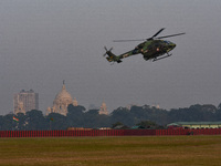 Indian army helicopters display maneuvers during a practice ahead of the Vijay Diwas celebration in Kolkata, India, on December 14, 2024. (