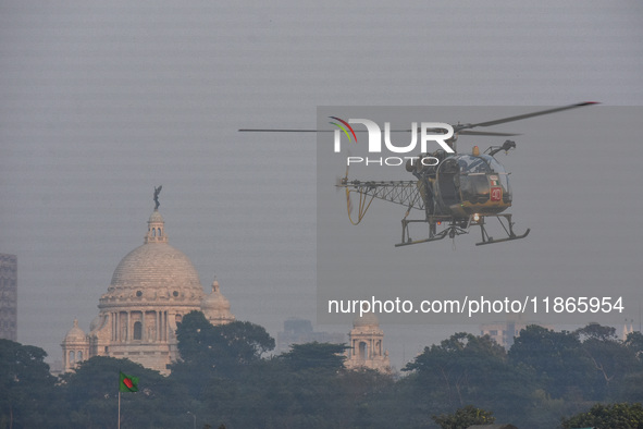 Indian army helicopters display maneuvers during a practice ahead of the Vijay Diwas celebration in Kolkata, India, on December 14, 2024. 