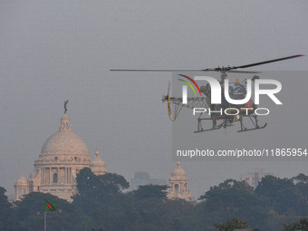 Indian army helicopters display maneuvers during a practice ahead of the Vijay Diwas celebration in Kolkata, India, on December 14, 2024. (