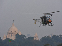 Indian army helicopters display maneuvers during a practice ahead of the Vijay Diwas celebration in Kolkata, India, on December 14, 2024. (