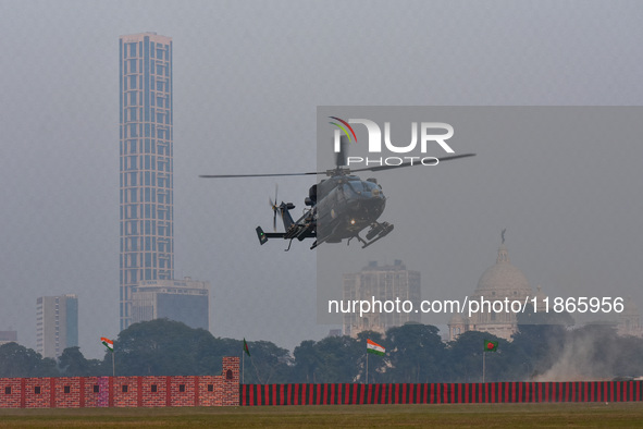 Indian army helicopters display maneuvers during a practice ahead of the Vijay Diwas celebration in Kolkata, India, on December 14, 2024. 