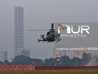 Indian army helicopters display maneuvers during a practice ahead of the Vijay Diwas celebration in Kolkata, India, on December 14, 2024. (