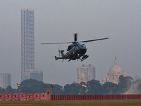 Indian army helicopters display maneuvers during a practice ahead of the Vijay Diwas celebration in Kolkata, India, on December 14, 2024. (