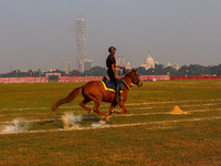 Soldiers of the armed forces perform acrobatic stunts on horses during practice for the Vijay Diwas celebration, as seen in Kolkata, India,...